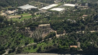 AX0015_008 - 5K aerial stock footage of a hillside rural home, Fallbrook, California