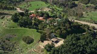 AX0015_016 - 5K aerial stock footage fly by large hilltop house, Fallbrook, California