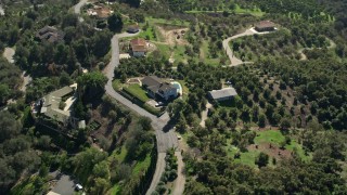 AX0015_024 - 5K aerial stock footage video of homes on hills, Fallbrook, California