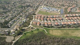 AX0015_043 - 5K aerial stock footage of a residential neighborhood and school in Oceanside, California