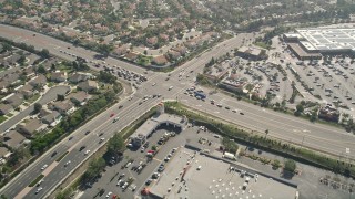 AX0015_045 - 5K aerial stock footage of orbiting a street intersection, Oceanside, California