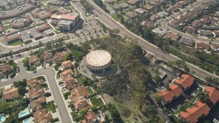 AX0015_047 - 5K aerial stock footage of a circular building in a residential community, Oceanside, California