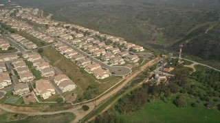AX0015_057 - 5K aerial stock footage flyby tract homes in a residential neighborhood, Oceanside, California