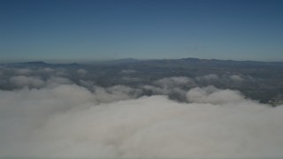 AX0016_013 - 5K aerial stock footage pan across the top of the clouds to reveal the edge of the layer, Oceanside, California
