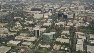 AX0016_082 - 5K aerial stock footage of office buildings on Von Karman Avenue in Irvine, California