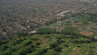 AX0016_094 - 5K aerial stock footage fly over Mile Square Golf Course, to and approach residential neighborhoods, Fountain Valley, California