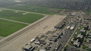 AX0016_098 - 5K aerial stock footage of military helicopters parked at Los Alamitos Army Airfield, California
