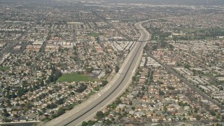 AX0016_102 - 5K aerial stock footage of Coyote Creek and suburban neighborhoods in Los Alamitos, California