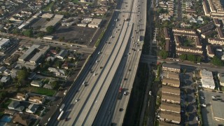 AX0017_028E - 5K aerial stock footage of following Interstate 110 along residential area, Gardena, California