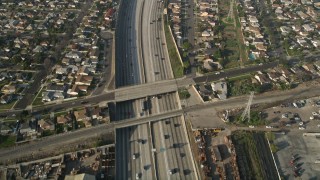 AX0017_030E - 5K aerial stock footage of following Interstate 110 along residential area, Gardena, California