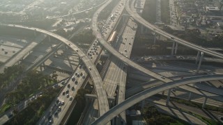 AX0017_033 - 5K aerial stock footage of following Interstate 110 and approaching interchange with Interstate 105, Westmont, California