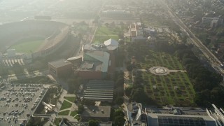 AX0017_042 - 5K aerial stock footage of University of Southern California campus and Exposition Park, California