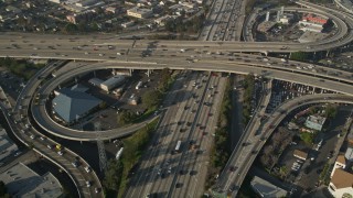 AX0017_060 - 5K aerial stock footage of following Interstate 110 over the 10 interchange, Downtown Los Angeles