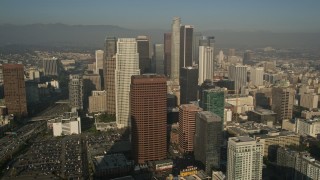 AX0017_071E - 5K stock footage aerial video of orbiting Ritz Carlton revealing skyscrapers, Downtown Los Angeles