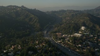 AX0017_085 - 5K aerial stock footage of Highway 101 through the Hollywood Hills, Hollywood, California