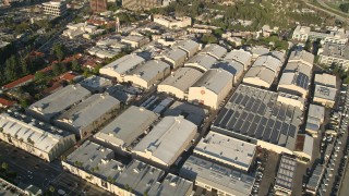 AX0017_101E - 5K aerial stock footage of orbiting Warner Brothers Studios, Burbank, California