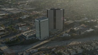 AX0017_108 - 5K aerial stock footage of office buildings and freeways, Burbank, California