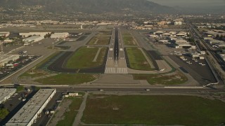 AX0017_111E - 5K aerial stock footage video of approaching Bob Hope International Airport, Burbank, California