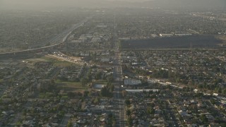 AX0017_115 - 5K aerial stock footage of approaching highways and residential neighborhoods, Sun Valley, California