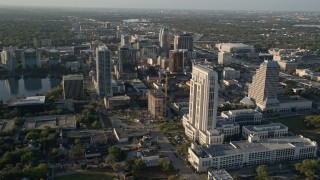 AX0018_014E - 5K aerial stock footage of flying over courthouse and office buildings in Downtown Orlando, Florida at sunrise