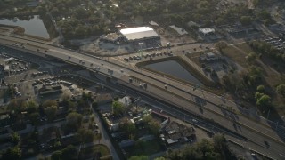 AX0018_025 - 5K aerial stock footage of light traffic on Highway 50 in Orlando at sunrise, Florida