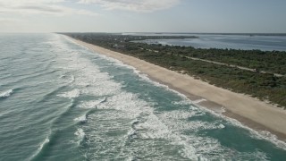 AX0018_077E - 5K aerial stock footage approaching beachfront homes, Melbourne Beach in Florida