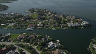 AX0018_084E - 5K aerial stock footage fly over waterfront homes on the Indian River in Melbourne Beach, Florida