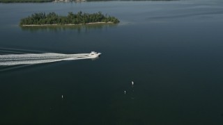 AX0018_086 - 5K aerial stock footage approach a fishing boat on the Indian River in Florida