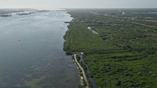 AX0018_096E - 5K aerial stock footage of shoreline of the Indian River by Fort Pierce, Florida