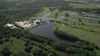 AX0018_099E - 5K aerial stock footage approach and orbit the Fairwinds Golf Course in Fort Pierce, Florida