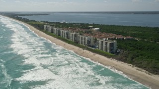 AX0019_002E - 5K aerial stock footage approach beachside apartment buildings in Port St. Lucie, Florida