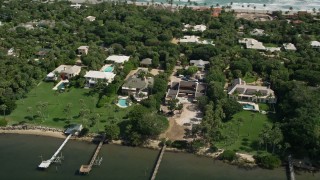 AX0019_024 - 5K aerial stock footage of upscale homes beside the Indian River in Hobe Sound, Florida
