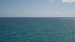 AX0019_029 - 5K aerial stock footage of calm blue waters of the Atlantic Ocean off the coast of Florida