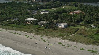 AX0019_031 - 5K aerial stock footage of beachfront homes in Hobe Sound, Florida