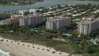 AX0019_051 - 5K aerial stock footage of oceanfront hotel and beach at Palm Beach Shores, Florida