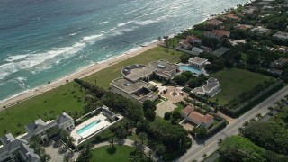AX0019_056 - 5K aerial stock footage of a spacious oceanfront mansion in Palm Beach, Florida