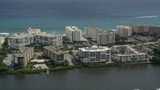AX0019_076E - 5K aerial stock footage flyby waterfront hotel and apartment buildings in Palm Beach, Florida