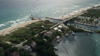 AX0019_083E - 5K aerial stock footage pan from a mansion to reveal inlet and Boynton Beach, Florida