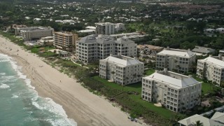 AX0019_087 - 5K aerial stock footage approach oceanfront condominiums and beach in Delray Beach, Florida