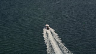 AX0020_006E - 5K aerial stock footage of tracking a speedboat cruising across Biscayne Bay, Florida