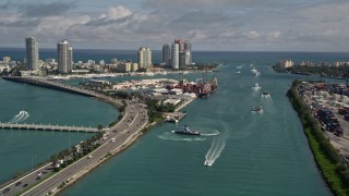 AX0020_039 - 5K aerial stock footage pan from ferries in Government Cut to skyscrapers in South Beach, Florida
