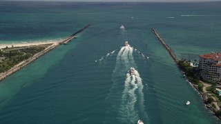 AX0020_042 - 5K aerial stock footage approach a line of ferries sailing on Government Cut in Miami, Florida