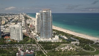 AX0020_043 - 5K aerial stock footage orbit modern beachfront skyscrapers in South Beach, Florida
