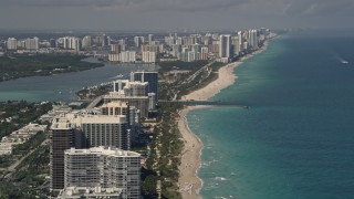AX0020_067E - 5K aerial stock footage of beachfront condos and hotels in Bal Harbour, with a view to Sunny Isles Beach, Florida