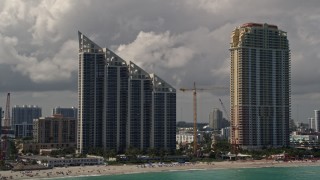 AX0020_078 - 5K aerial stock footage of oceanfront condominium high-rise and resort hotel in Sunny Isles Beach, Florida