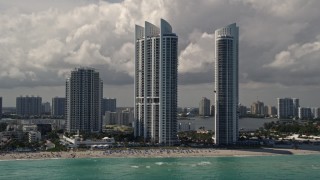 AX0020_079E - 5K aerial stock footage of luxury resort hotels on the beach in Sunny Isles Beach, Florida