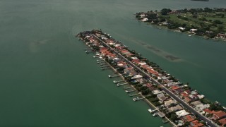 AX0020_099 - 5K stock footage aerial video fly over island waterfront homes on Biscayne Point, Florida