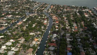 AX0021_006E - 5K aerial stock footage of canals through waterfront community of Keystone Islands, Florida