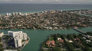 AX0021_015 - 5K aerial stock footage approach coastal community of Surfside, Florida
