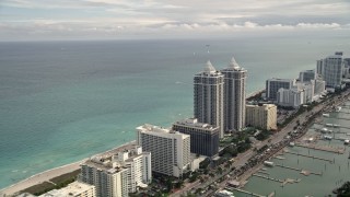 AX0021_028E - 5K aerial stock footage of oceanfront hotels and condominiums in the coastal city of Miami Beach, Florida